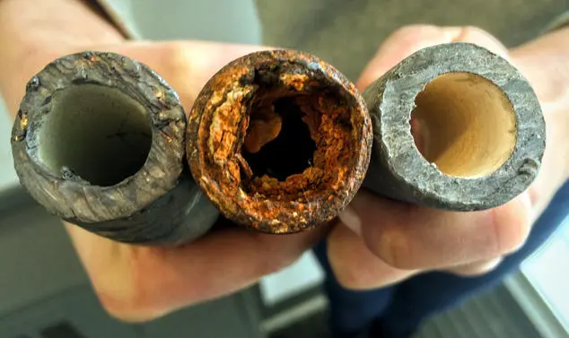 Three pipe sections showing progressive scale build-up