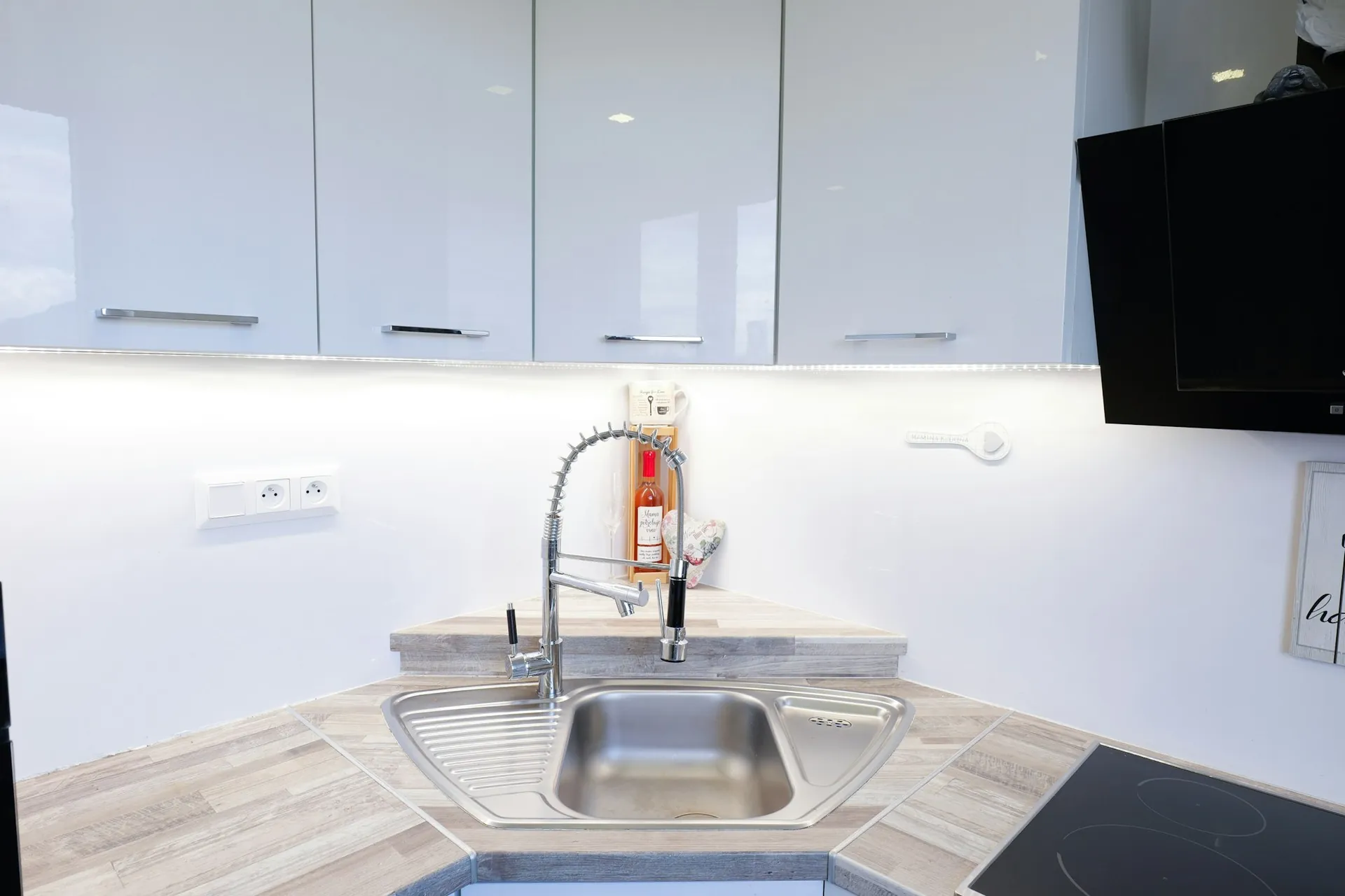 A bright, modern kitchen sink and faucet